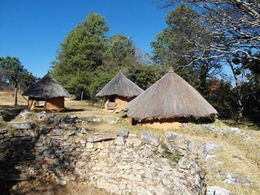 Image of African huts on a cultural walk at Nyanga National Park, Zimbabwe