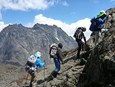 A group of people hiking the Rwenzori Mountains
