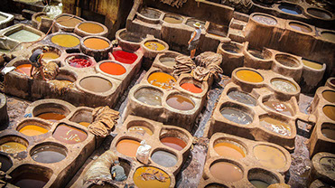 The maze-like medina colorful leather-dying pits in Fez, Morocco are a must visit for tourists visiting north Africa.